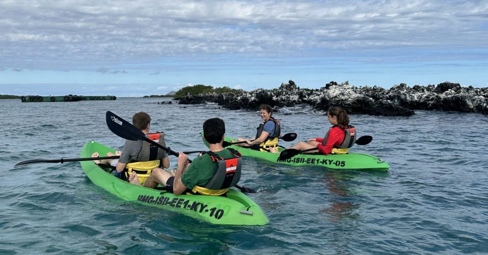 Students kayaking during a guided educational tour in the Galápagos Islands