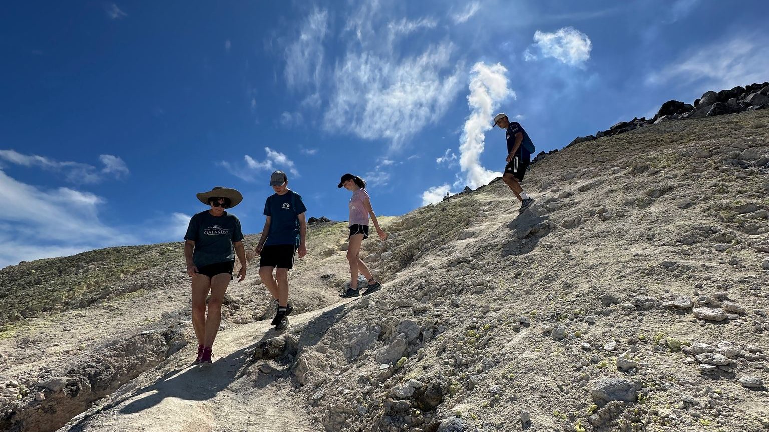 Students hiking Sierra Negra volcano during an educational trip in the Galápagos Islands