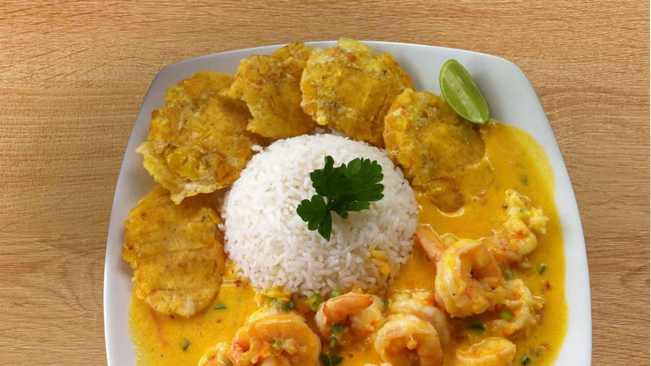 Local Ecuadorian dish from the Galápagos coconut shrimp paired with crispy fried plantains
