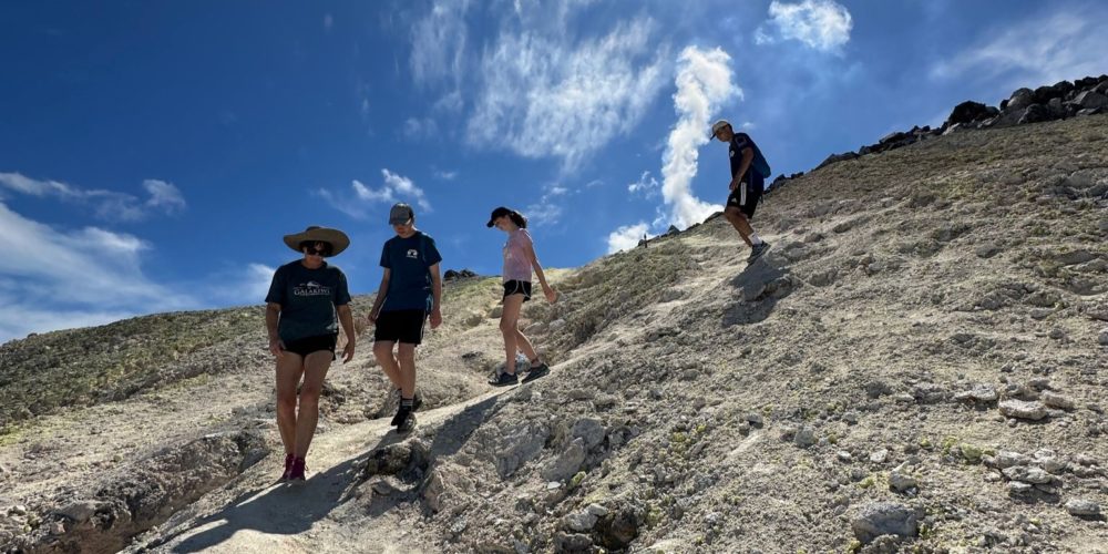 Family adventure hiking the dramatic Sierra Negra Volcano in the Galápagos