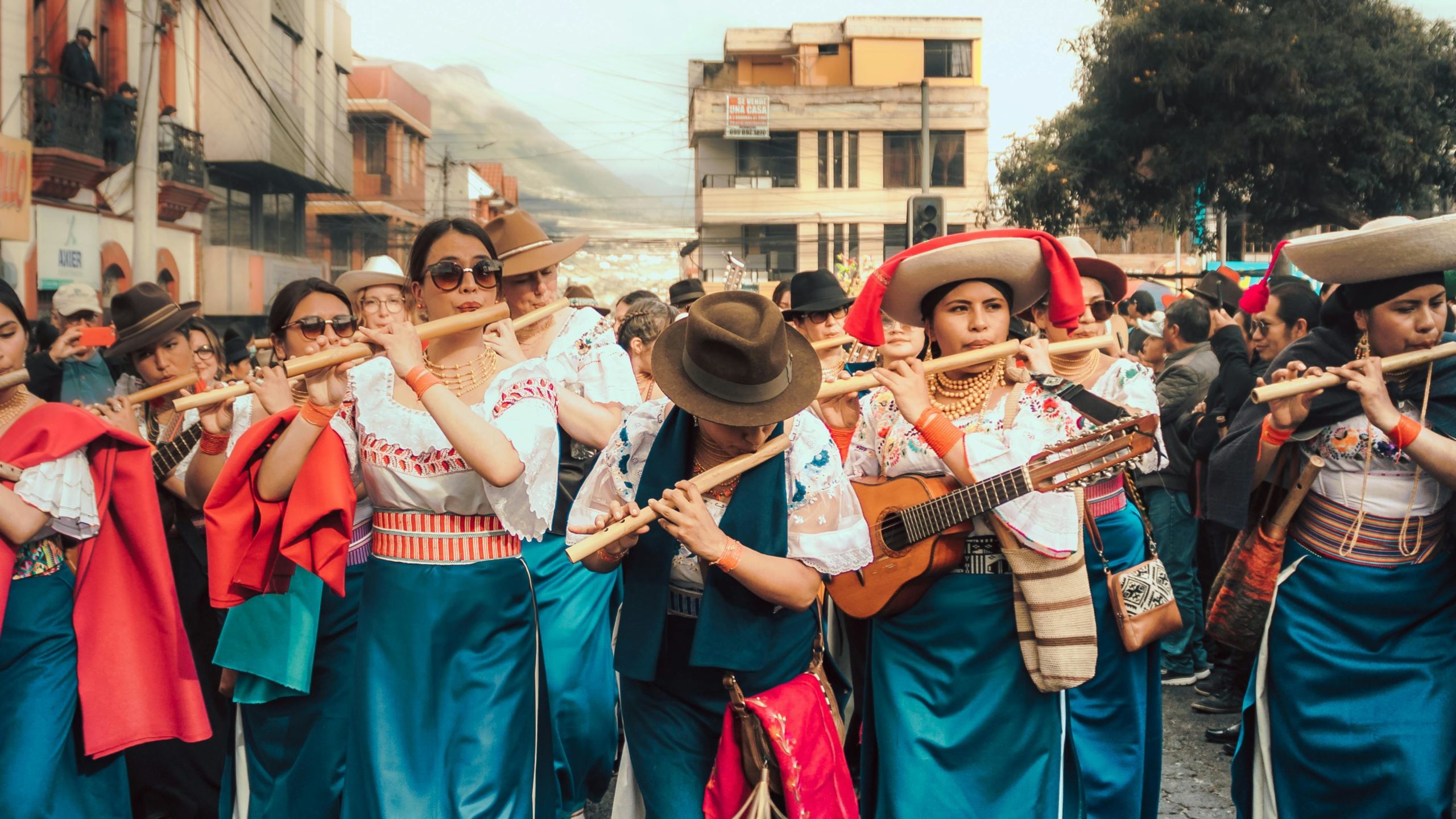 Photo by RYMAK SANTILLÁN parade of flute playing women during the inti festival 